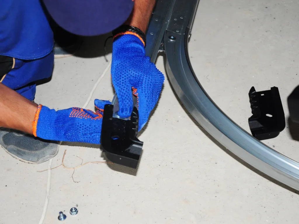 a professional fixing a garage door